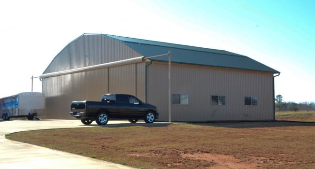 residential steel airplane hangar with stack doors