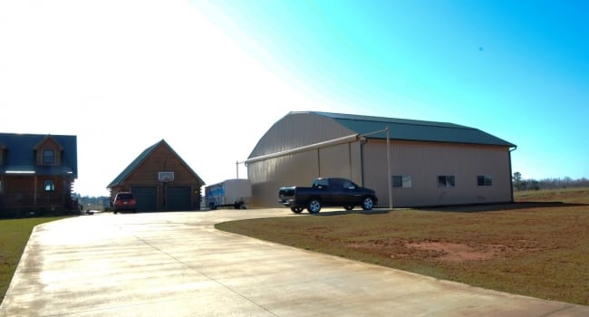 residential metal airplane hangar with stack doors