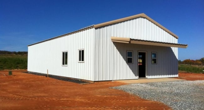 metal shop with below eave structural canopy