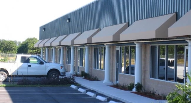 retail strip shopping center with decorative canopies