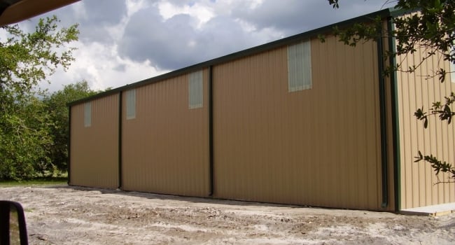 metal garages for truck repair with light transmitting wall panels