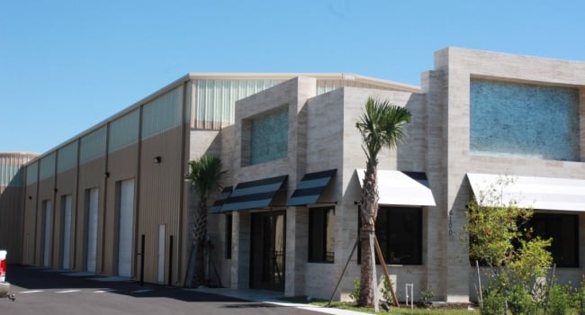 metal building warehouse attached to custom granite showroom