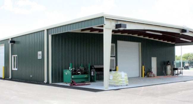 metal building with inset covered bay and white frames