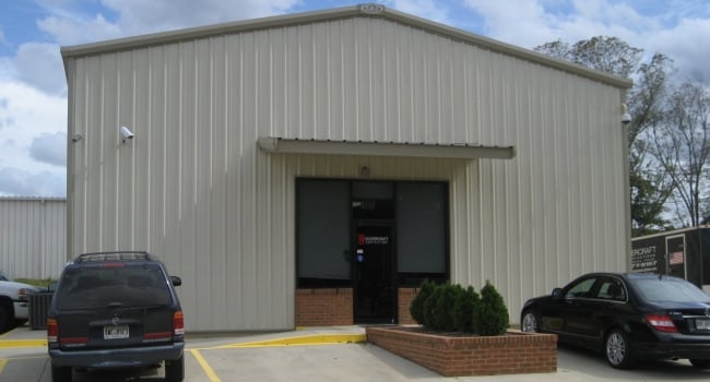 metal commercial office building with below eave structural canopy with soffit