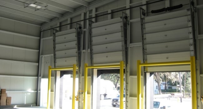 steel building warehouse with loading dock and ballards