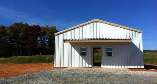 metal shop with below eave structural canopy