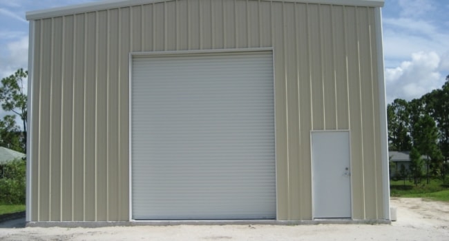 metal riding arena with canopy and purlin extensions