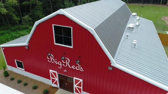 Retail red metal gambrel barn.