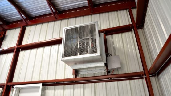 Metal building wall mounted electric exhaust fan.