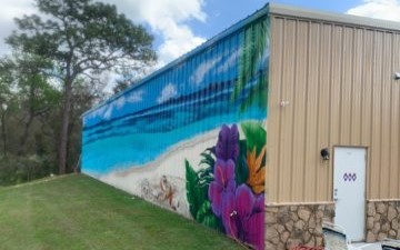 metal garage kit with custom florida themed mural painted on sidewall